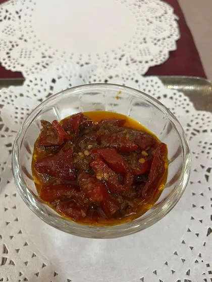 A serving of my Pahari Laal Mirch pickle. Made from red chillies sourced from the hills, this pickle has a deep, smoky heat.