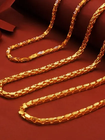 A clean and classic studio shot of intricate gold chains against a rich red background. This is an example of my e-commerce product photography, where the focus is entirely on the product's detail, texture, and craftsmanship.