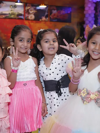 A group of happy friends celebrating a unicorn-themed birthday. Seeing these smiles and friendships blossom is why I love what I do.
