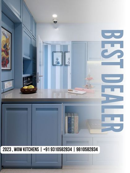 As a leading dealer in Delhi, we specialize in creating highly functional spaces. This kitchen showcases how we integrate storage solutions seamlessly into any design, like this blue kitchen with open shelving and custom cabinets.