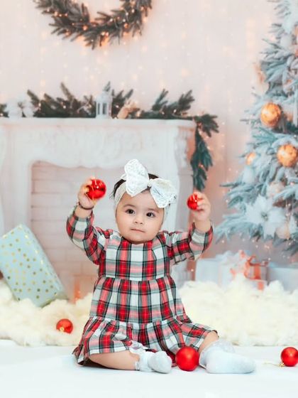 This little girl is ready to decorate the tree! My Christmas setups include everything needed for a classic holiday portrait.