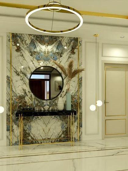 Another view of the lobby, showcasing the clean lines of the doors with brass trim and the overall bright, airy feel.