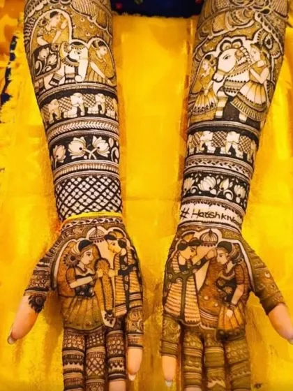A very detailed Rajasthani bridal design depicting a full 'baraat' (wedding procession) scene with elephants and palanquins. The palms show the bride and groom, telling a complete wedding story.