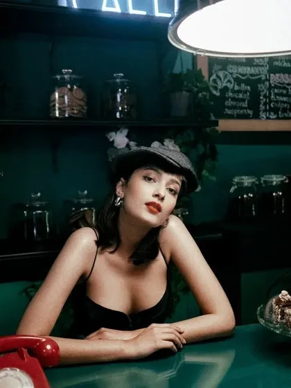 A classic beauty look with a bold red lip and winged liner. This timeless makeup style is perfect for creating a chic, Parisian-inspired portrait.