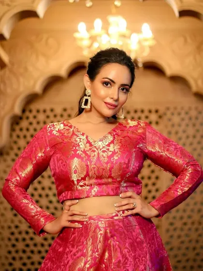Getting the beautiful actress Aanchal Munjal ready for a festive Diwali shoot. I designed a glamorous yet traditional look with dewy skin and warm tones to match her vibrant pink brocade lehenga, making her shine with festive elegance.