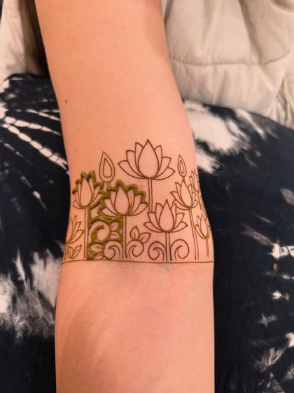 A collection of designs with fresh henna paste, showing the clean lines and 3D effect before the paste dries and falls off.
