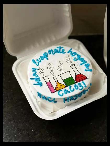 Another look at the fun science-themed bento cake. The colorful beakers and bubbles make it a visually appealing and unique design for any science enthusiast.