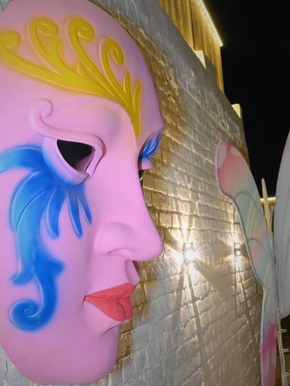 A side view of the artistic mask and butterfly wing installation. These details are what make the ambiance here so unique and memorable.