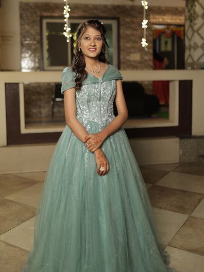 A simple yet elegant gown for any occasion. This client looks beautiful in a pastel green ball gown, available for rent at an affordable price.