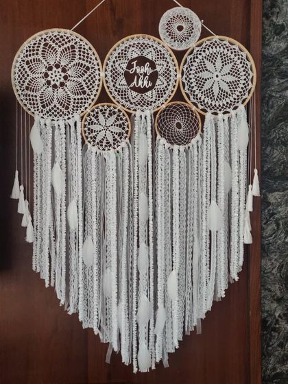 There is a simple divinity to the color white. This all-white cluster dreamcatcher, personalized for 'Jash & Akki', is pure, elegant, and brings a sense of peace to the room.