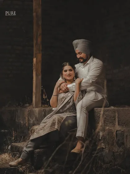 A tender moment shared on stone steps. Aman holds Simran close in this beautifully lit portrait, which has the feel of a classic, romantic painting.
