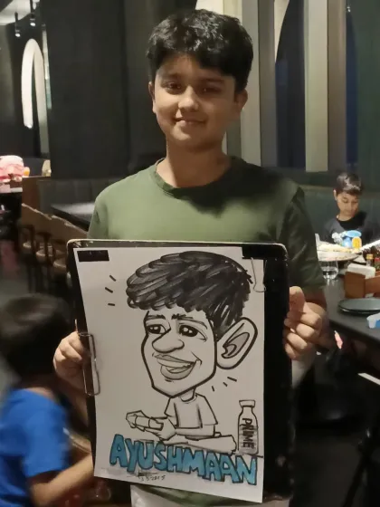 A young man with his caricature, personalized with his name.