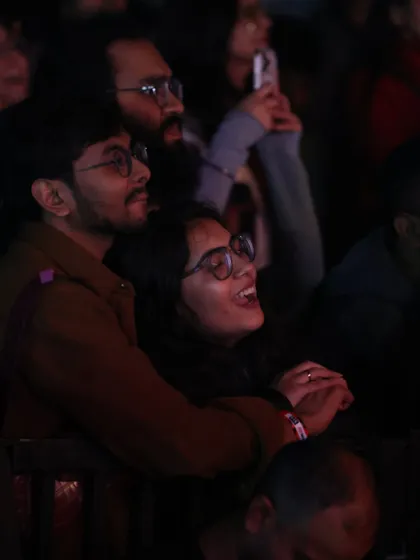 A couple enjoying the concert together, lost in the moment. Our events are perfect for making memories with the people you care about.