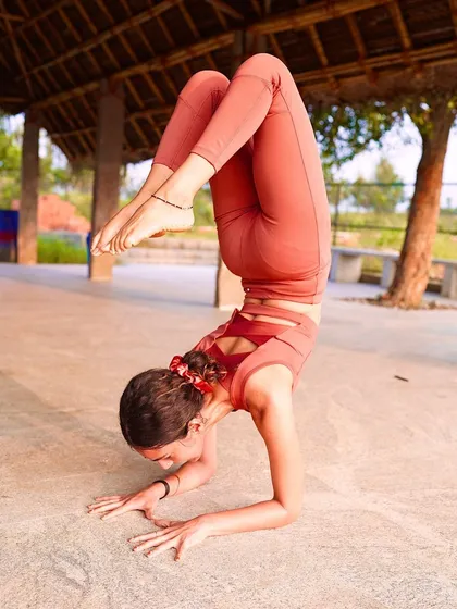 A powerful forearm stand, demonstrating the strength and balance cultivated through consistent yoga practice. This pose is a testament to what we can achieve when we believe in ourselves.
