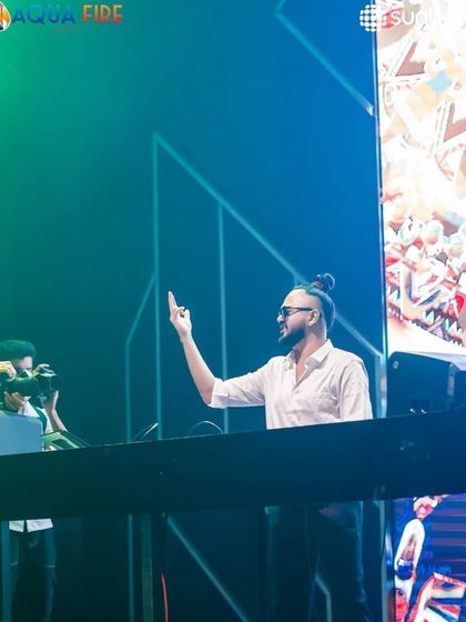 Pointing to the sky at Sunburn Union, feeling the energy.