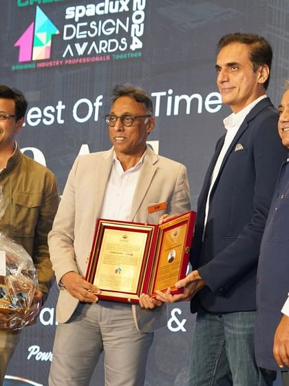 Receiving the G.O.A.T. Award on stage. It is a privilege to be recognized by my peers in the industry.