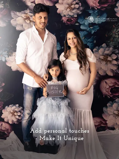 A perfect family portrait announcing a new role: "Big Sister." Including older siblings and personal props like this chalkboard makes the session uniquely yours.
