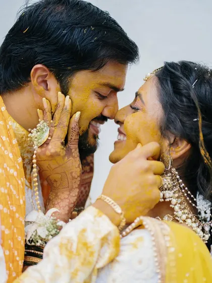A playful and intimate moment during the Haldi. We get up close to capture the laughter and emotion, making you feel like you are part of the celebration.