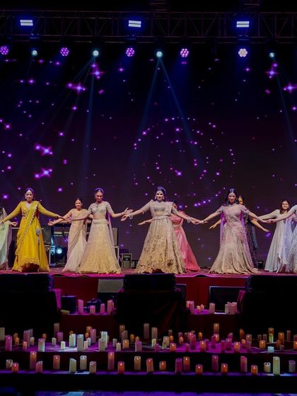 The bride and her bridesmaids performing on the candle-lit stage. The coordinated outfits and simple, graceful choreography looked beautiful against the starry night backdrop of our Sufi theme.