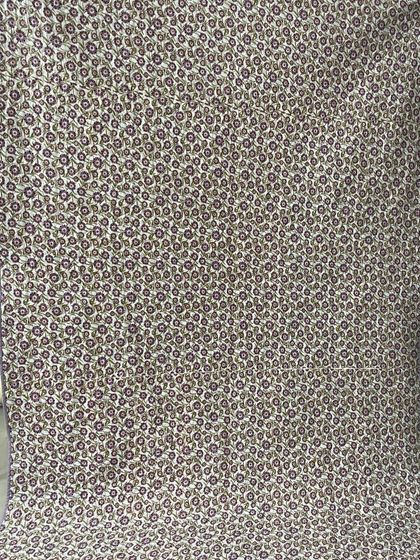 The floral backing fabric for the purple block quilt.