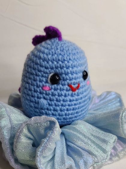 My tiny dino keychains are a handful of cuteness. They come in four different colors: blue, yellow, green, and grey.