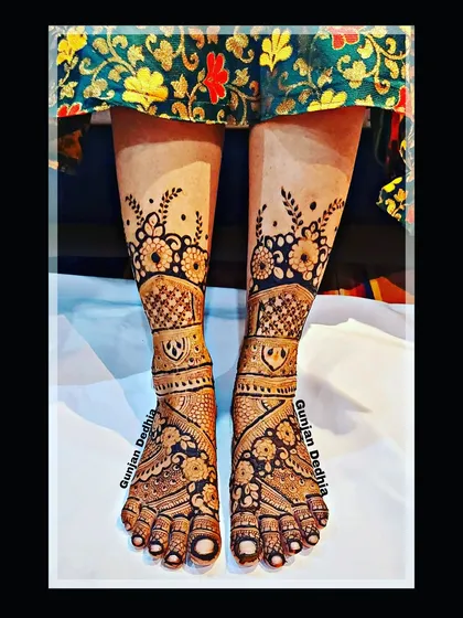 A beautiful floral mehendi design for the feet. The pattern is intricate and covers the entire foot, perfect for a bride.