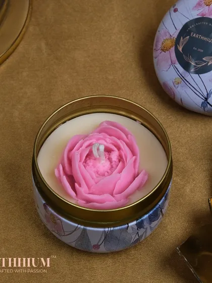 A beautiful pink peony candle in a floral-printed tin. The lid makes it a great travel companion.
