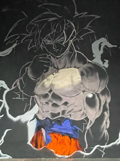 Another process shot of the Goku piece. You can see the layers building up, from the initial sketch to the shading and color. It's a process of bringing the character to life.