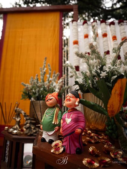 Adorable "Gombe" or traditional dolls, add a touch of cultural charm to the decor. These were placed on antique tables as part of a larger, personalized stage setup.