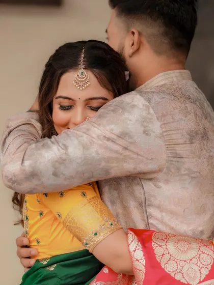 A warm hug between the couple during their pre-wedding festivities.