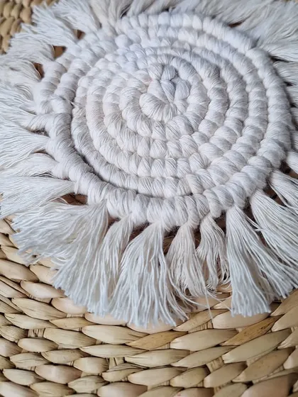 A top-down view of the spiraled coaster, highlighting the beautiful pattern created by the knots.