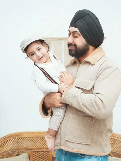 A candid moment between a father and his son. We aim to capture the natural, loving interactions that happen during our family photoshoots.