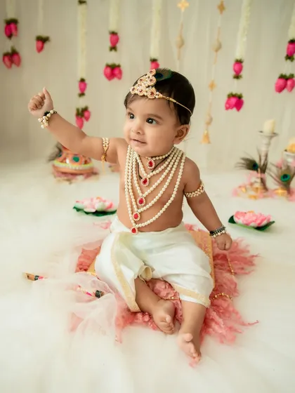 A playful pose from a little Krishna. Capturing the active and fun-loving side of your baby is just as important as the calm, posed shots.