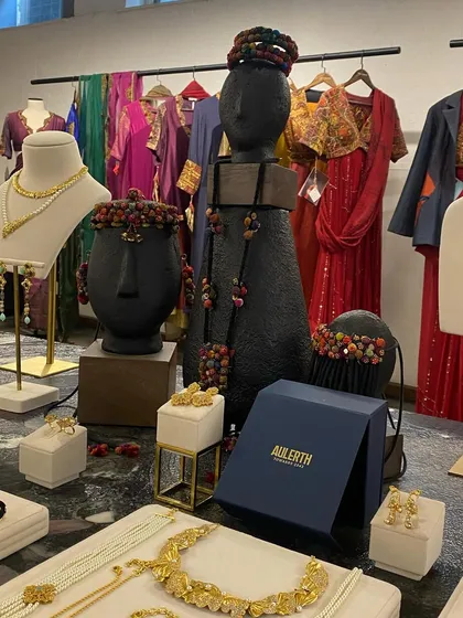 A display of handcrafted jewellery from Aulerth and clothing from Medha. I excel at curating multi-brand events, creating a cohesive showcase for complementary, women-led labels.