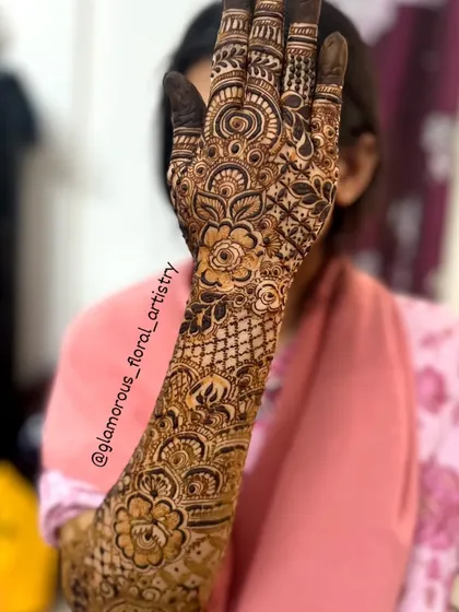 A full forearm design showcasing a cascade of flowers and vines, a popular choice for brides and bridesmaids alike.