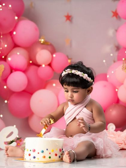 The cake is here! The anticipation and excitement before the cake smash is a precious moment we love to capture during first birthday sessions.