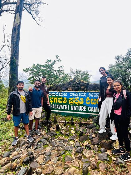 A group photo at the entrance of the Bhagavathi Nature Camp, the starting point for our Kudremukha adventures.