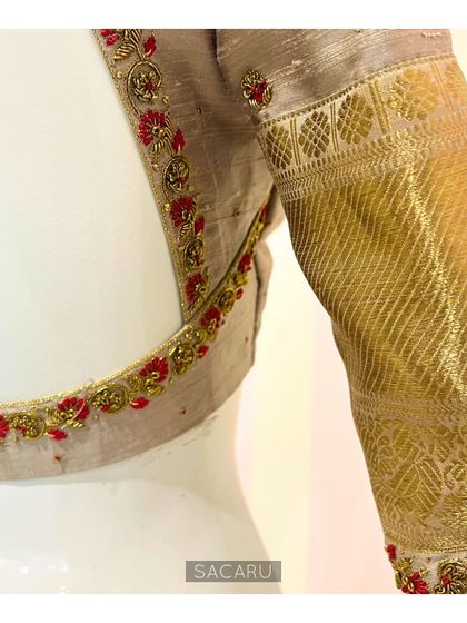 A side view of the traditional Kanjeevaram blouse, highlighting the use of the saree's gold border on the sleeve.