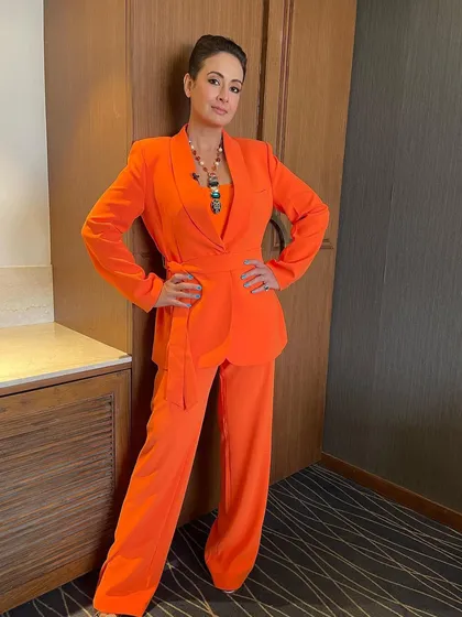 For Preeti Jhangiani's promotional events for her show 'KAFAS', we started with this powerful look. A slicked-back, tight updo that complements her bold orange pantsuit.