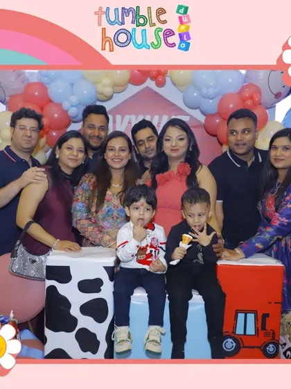 A fun group photo of friends and family celebrating a little one's birthday. The joy is contagious!
