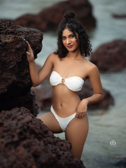Another beautiful shot from the white bikini series, with the model posing in the water. The soft, natural light is ideal for creating flattering and timeless beach portraits.