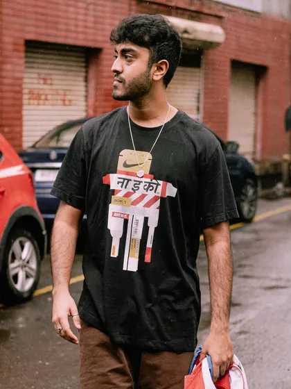 A shot from my collaboration with Nike. I'm wearing a custom tee that blends street style with a local touch, which is what my whole vibe is about.