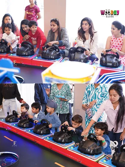 Our arcade section is packed with fun games that bring out the competitive spirit in everyone. Here, kids and adults are seen enjoying a racing game together.