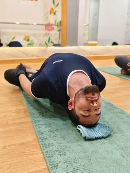 The fish pose, or Matsyasana, is a beautiful heart opener that also stretches the neck and spine. Here, a client finds deep relaxation in this restorative posture.