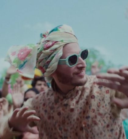 A fun moment from the baraat scene, where I styled one of the guests in a printed kurta with a floral safa and cool sunglasses for a modern festive look.