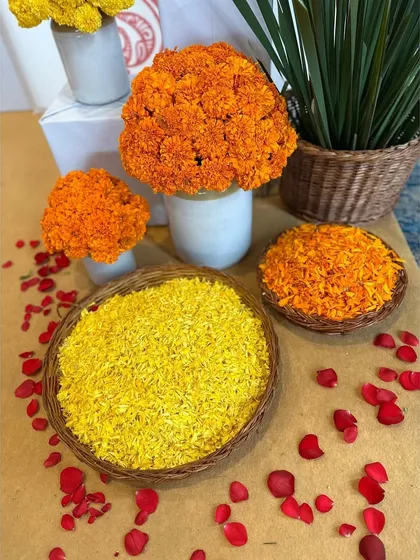 Baskets of fresh marigold petals, ready for guests to shower the couple with blessings.