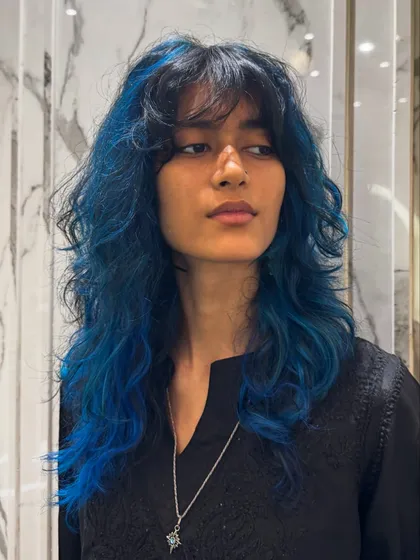 This layered blue look is edgy, modern, and full of personality.