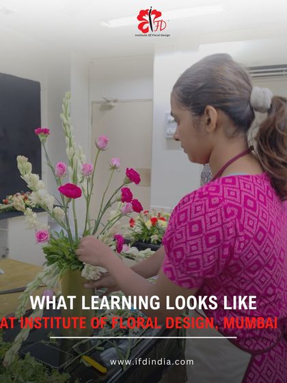 This image shows a student deeply engaged in creating her arrangement. Our classes provide a supportive environment where you can immerse yourself in the art of floral design.