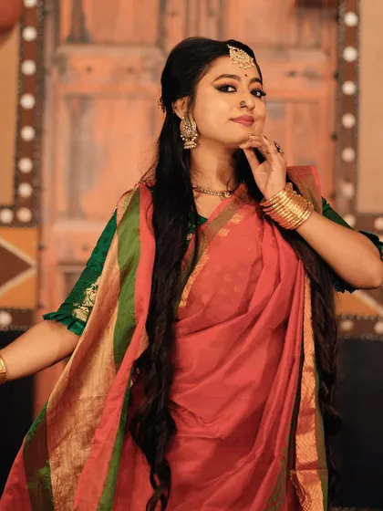 A graceful pose in my Bengali attire, capturing the essence of Pujo celebrations.