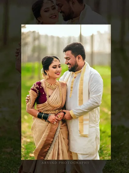 A portrait of a couple in their traditional wedding attire, set against a natural, green backdrop, showcasing their serene connection.